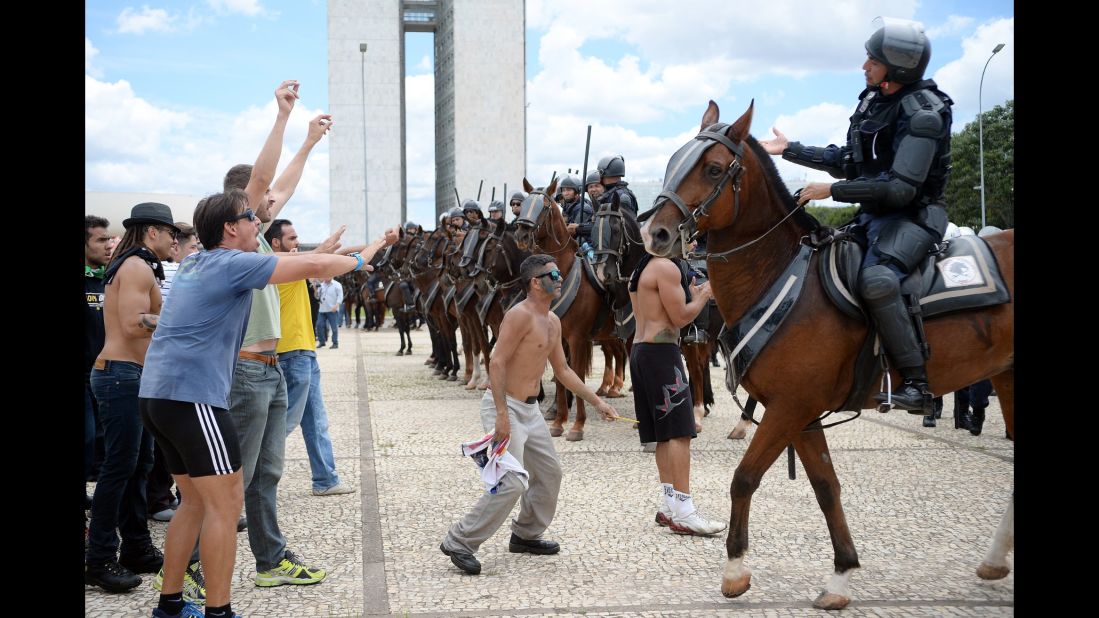 Protesters face off with police in Brasilia on March 17.