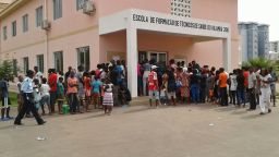 People gather for shots at a vaccination post during the campaign against yellow fever in the Kilamba neighborhood in Luanda, Angola.