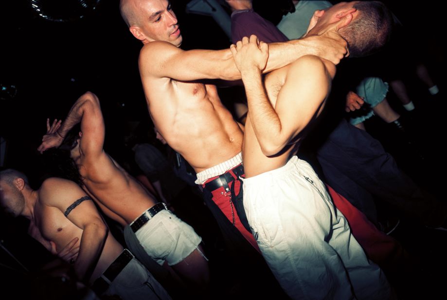 Men dancing in a club in New York by Nick Waplington,<em>The Isaac Mizrahi Pictures</em>
