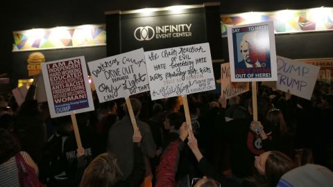 Protesters gather outside the Infinity Event Center where Republican presidential candidate Donald Trump was to speak at a campaign rally in Salt Lake City, Utah.