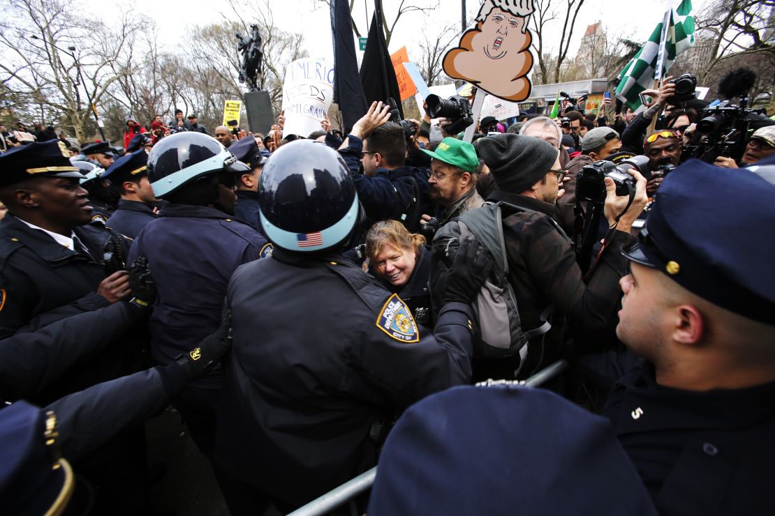 Protesters clash with NYPD officers while they take part in a protest against Republican presidential candidate Donald Trump on March 19, 2016 in New York City.