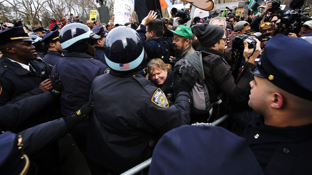 Protesters clash with NYPD officers while they take part in a protest against Republican presidential candidate Donald Trump on March 19, 2016 in New York City.