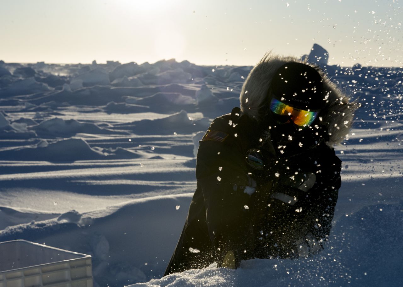 Fire Control Technician 1st Class David Toone, assigned to the Arctic Submarine Laboratory, mines ice that will be melted down and used as drinking water.