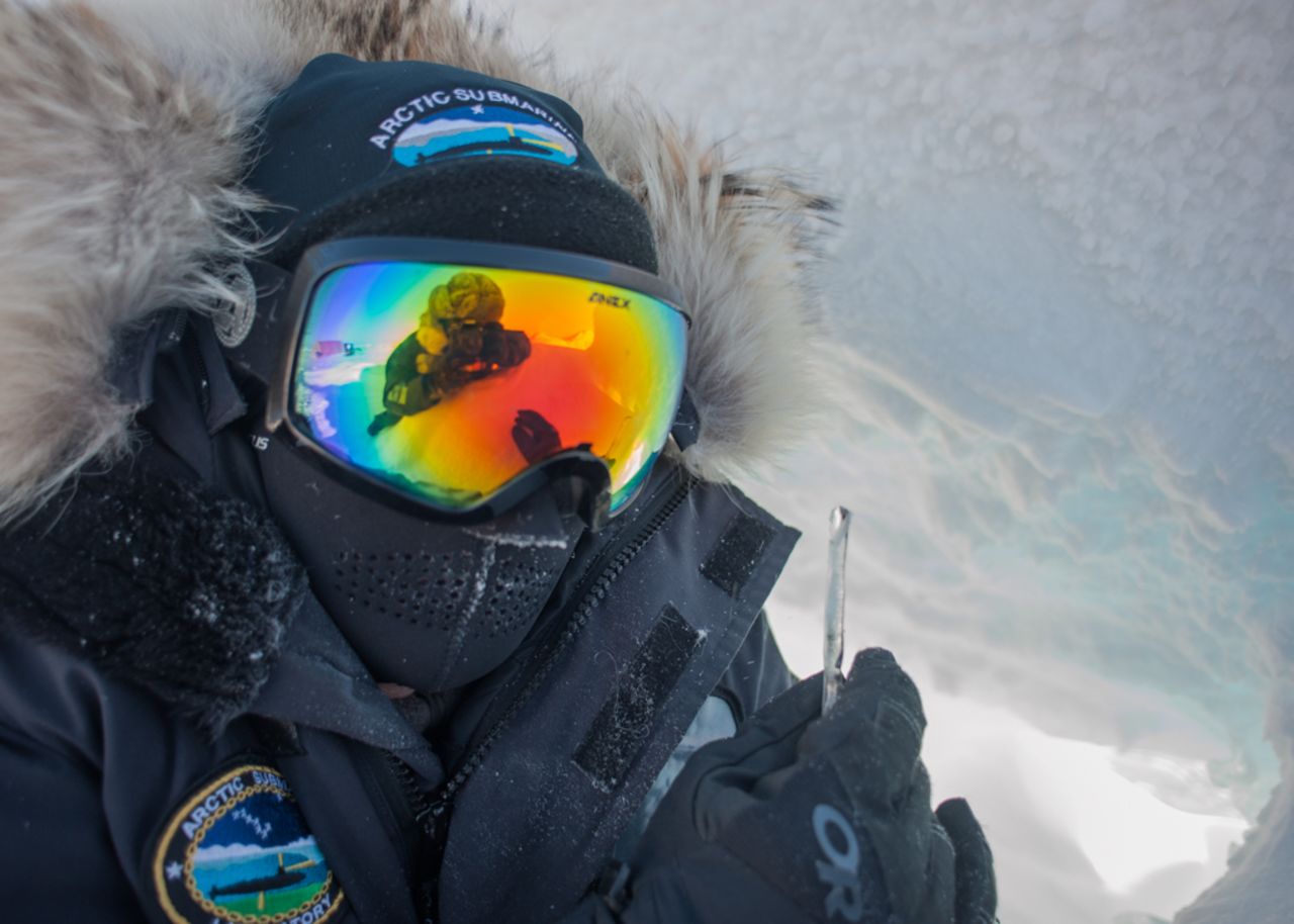 Fire Control Technician 1st Class David Toone looks for ice that can be melted down and used for potable water during ICEX 2016.