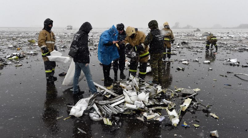 Russian investigators work at the wreckage of the <a href="index.php?page=&url=http%3A%2F%2Fedition.cnn.com%2F2016%2F03%2F18%2Feurope%2Frussia-plane-crash%2F" target="_blank">flydubai passenger jet that crashed on March 19,</a> killing all 62 people on board as it tried to land in bad weather in Rostov-on-Don.
