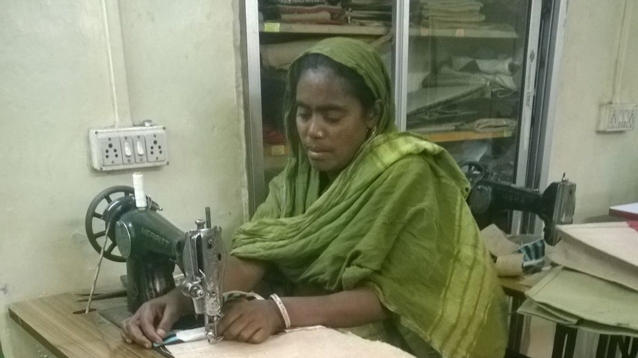 Mumtaj Bibi joined Apne Aap 13 years ago and learned how to sew. She has used the money she has earned to pay for her children's education.