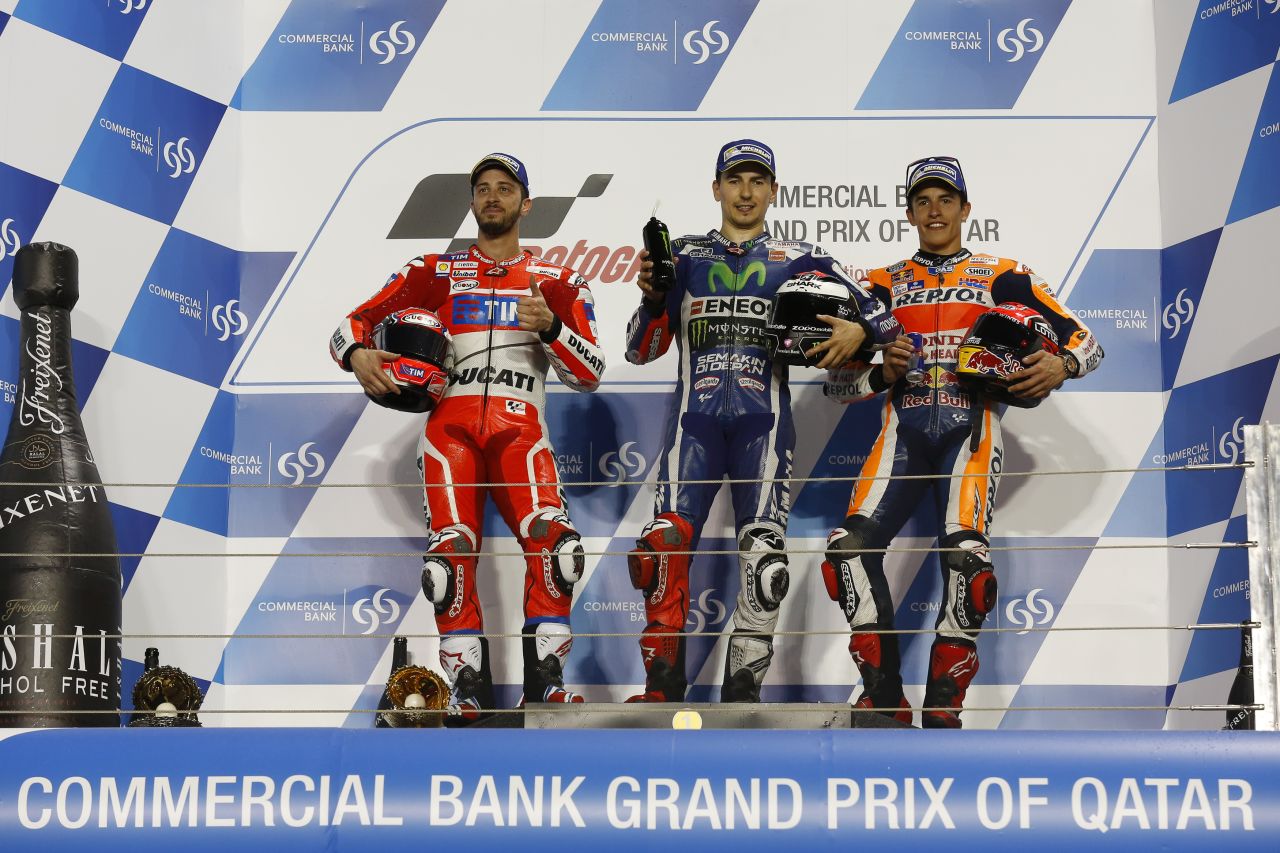 Yamaha's Jorge Lorenzo stands proudly atop the Qatar podium after his victory in this season's inaugural Grand Prix. Andrea Dovizioso of Ducati claimed second, while Marc Marquez of Honda seized third. 
