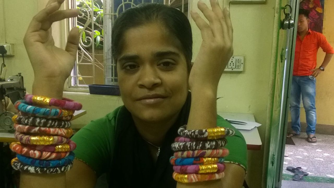 Ruby was once a student at Apne Aap and now she works with other women to make the bracelets sold by Rosena Sammi Jewelry. The money she earns supports her family. 
