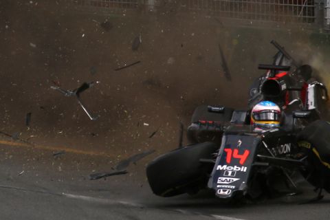 Alonso's car crashed into the wall at 200mph, flipping through the air before coming to rest upside down.