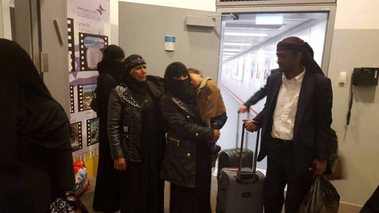 Some member of Yemen's tiny Jewish community, who made a cloaked journey, arrive in Israel.