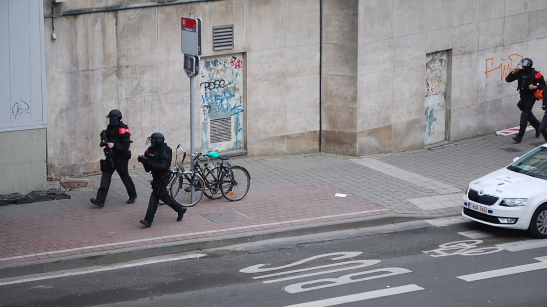 Police officers guard the area around the subway station.