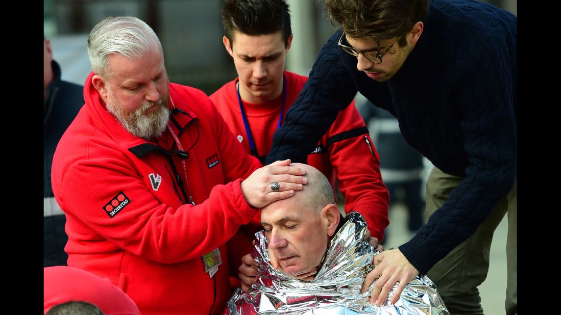 A victim receives first aid near the Maelbeek metro station.