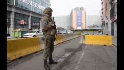 A Belgian soldier stands guard at the Berlaymont building, the headquarters of the European Commission, Tuesday morning after an explosion near the Maalbeek subway station.