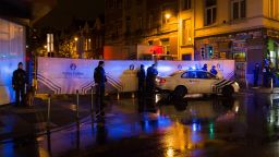 Belgian police cordon off a street during a police raid in connection with the November 13 deadly attacks in Paris, in Brussels' Molenbeek district on November 14, 2015.