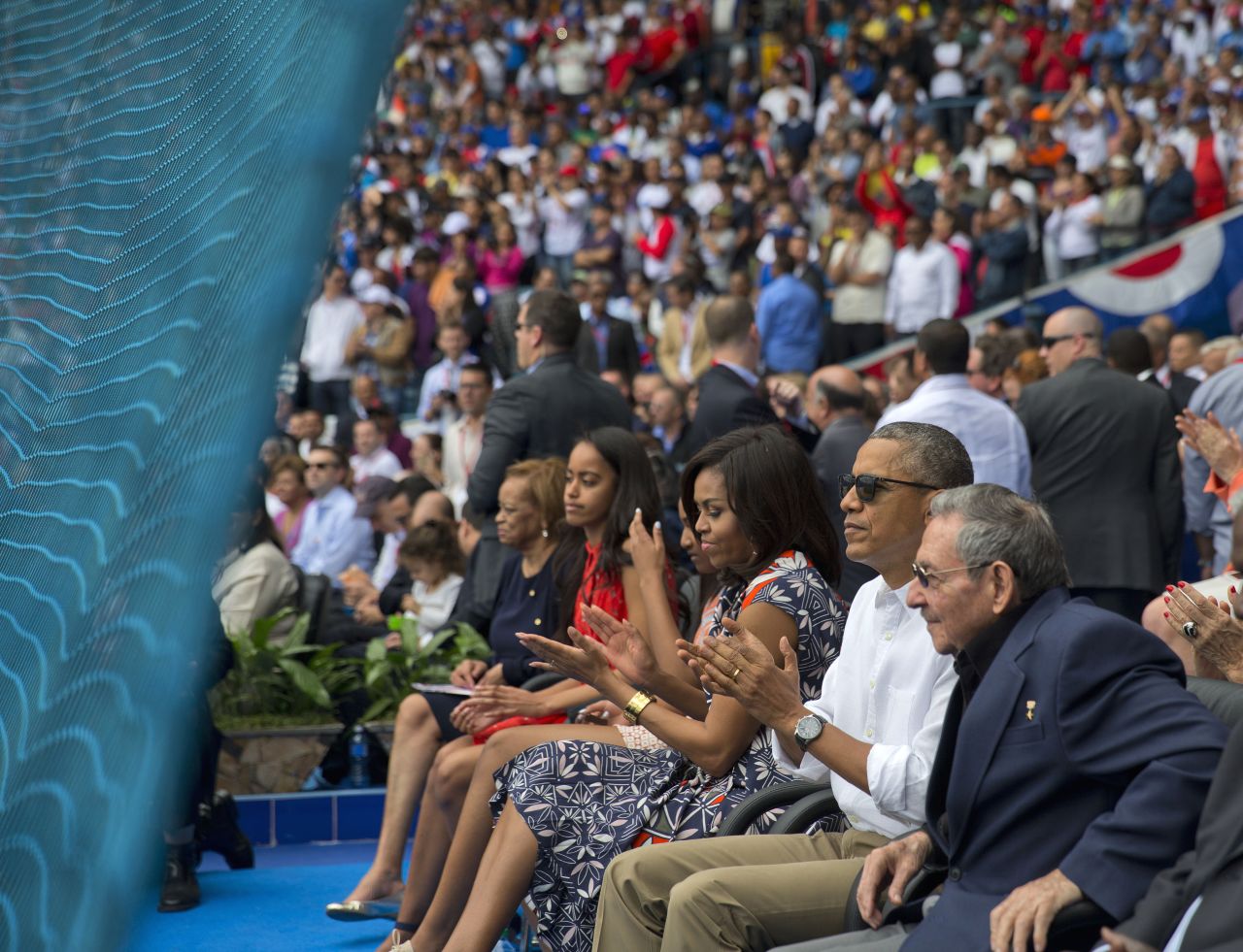 U.S. President Barack Obama attends a baseball game in Havana, Cuba, with his family and Cuban President Raul Castro, right, on Tuesday, March 22. The Cuban national team was playing an exhibition against Major League Baseball's Tampa Bay Rays. Obama is the first U.S. President to visit Cuba since Calvin Coolidge in 1928.