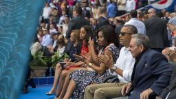 President Barack Obama, with his family, and Cuban President Raul Castro attend a exhibition baseball game between the Tampa Bay Rays and the Cuban National team at the Estadio Latinoamericano, Tuesday, March 22, in Havana, Cuba.
