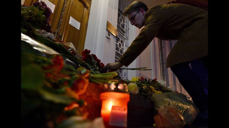 A man places flowers outside the Belgian Embassy in Moscow on March 22.
