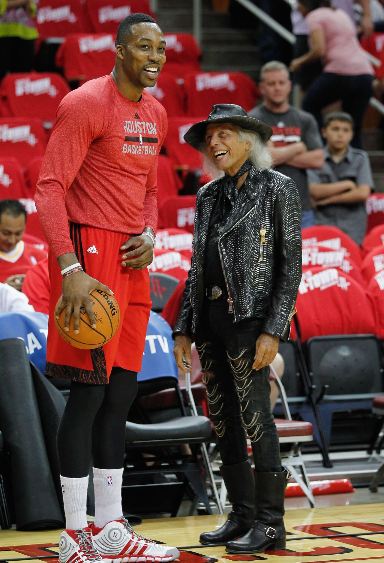Known as "Jimmy" to his friends, Goldstein likes to arrive at NBA games 45 minutes before tipoff to socialize with players, many of whom he calls friends. He is pictured here with Dwight Howard of the Houston Rockets before a 2014 Western Conference playoff game in Houston, Texas.