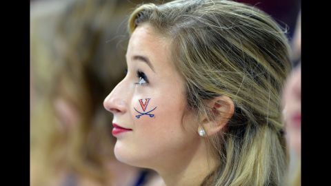 A Virginia cheerleader smiles before the second-round game against Butler on Saturday, March 19.