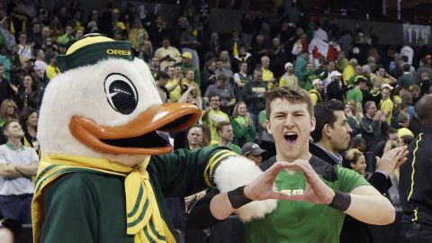 Oregon's mascot and cheerleaders celebrate after a victory on Sunday, March 20.