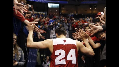 Wisconsin's Bronson Koenig is congratulated by fans following a second-round win on Sunday, March 20. Koenig <a href=