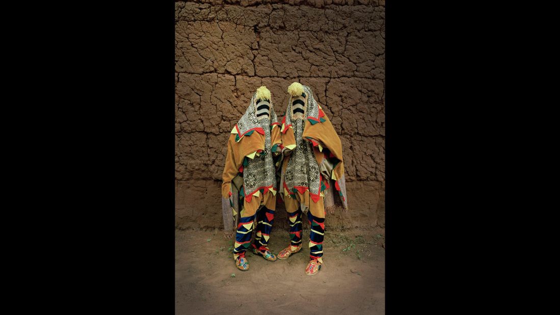 "Untitled", Leonce Raphael Agbodjélou (2011). This work is part of the portrait series "Vodou." The artist, a photographer from Benin, has used brightly colored costumes traditionally used by masqueraders at Yoruba funerals.