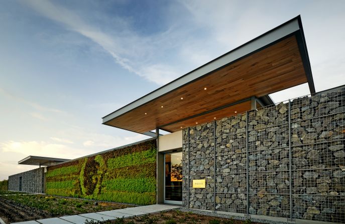 The estate combines the owner's passions for wine, cuisine and horses, but also incorporates sustainable design including Gabion walls which use locally quarried stones.