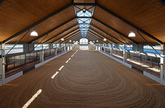 Equestrian facilities on the estate include an outdoor training center and this impressive indoor arena.