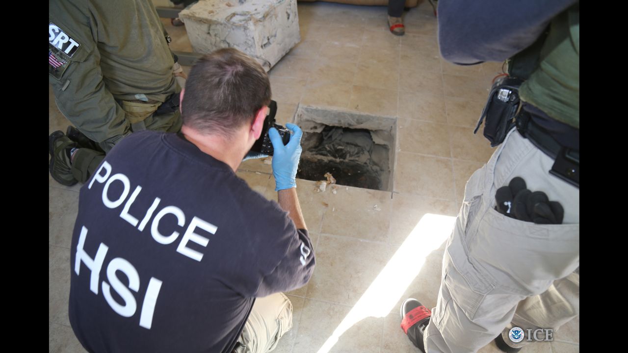 Federal agents photograph tunnel exit inside a house in Calexico, California.