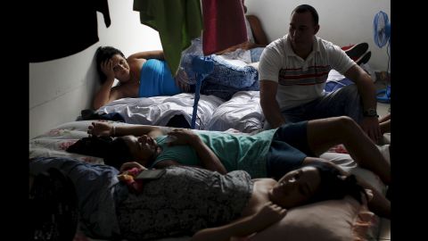 Cuban migrants rest in an old hotel used as a provisional shelter in Paso Canoas, Panama, on March 20.