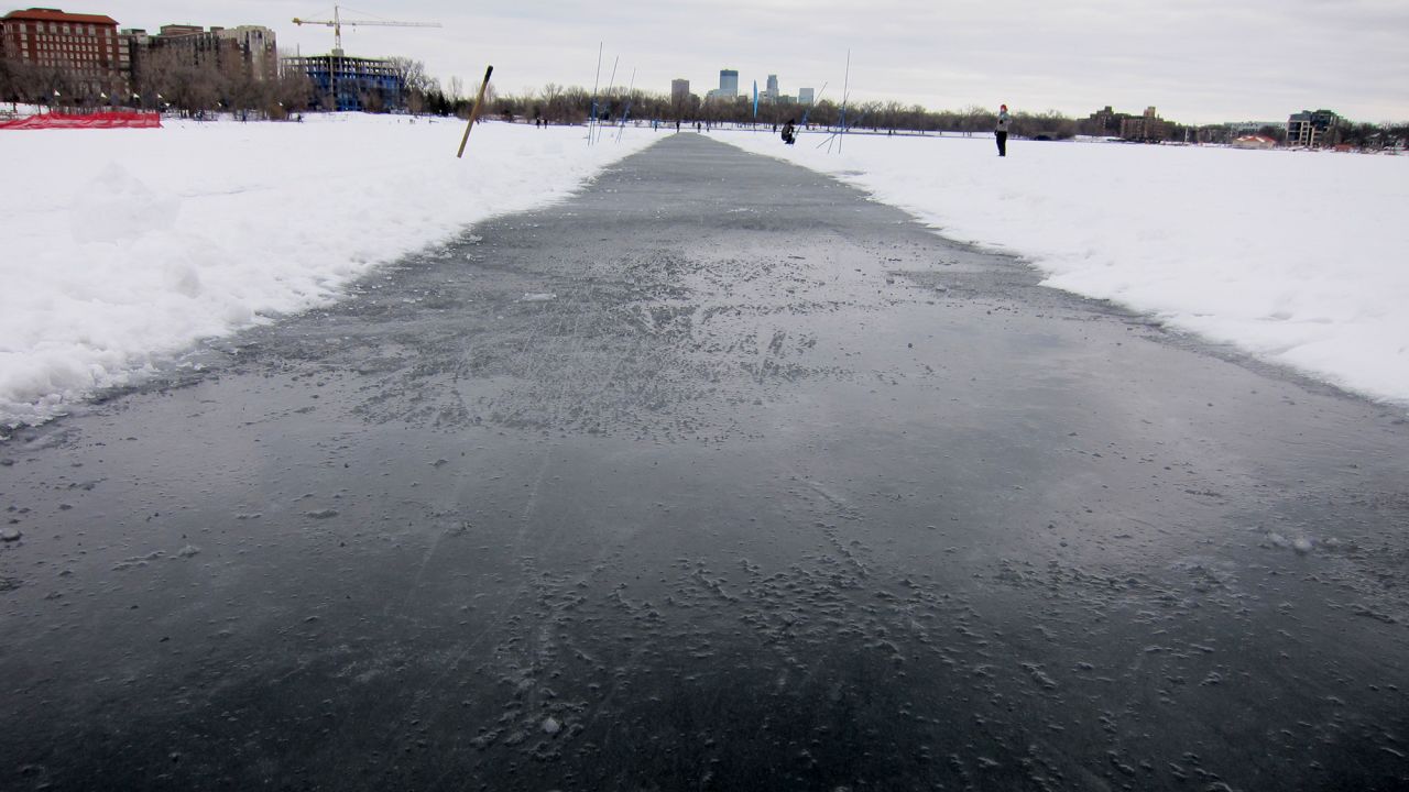A speed skate track is groomed into the lake as part of the Loppet.
