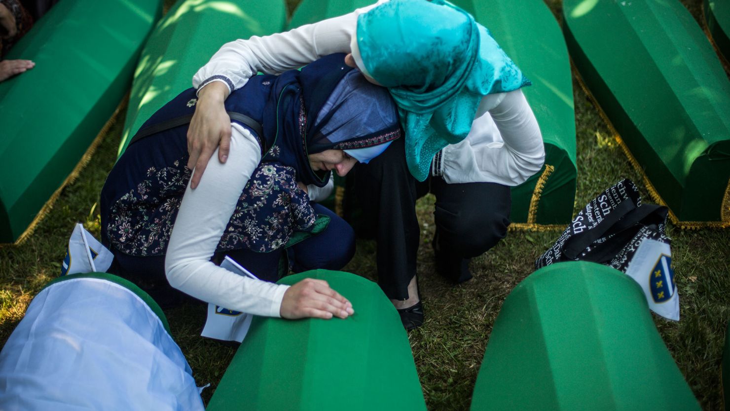 Women mourn at a mass funeral for 136 newly identified victims of the 1995 Srebrenica massacre at the Potocari cemetery and memorial in Srebrenica, Bosnia and Herzegovina on July 11, 2015. 