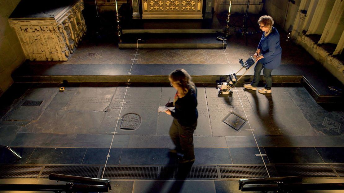 Archaeologists used radar scans to perform a non-invasive survey of William Shakespeare's grave. It is the smaller square stone to the right of the yellow tape measure lying on the floor.