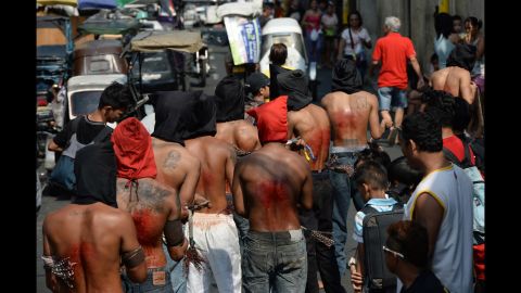 Penitents flagellate themselves as part of Holy Week celebrations in Manila, Philippines, on March 24.