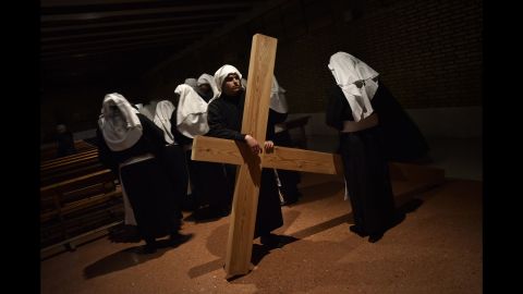 Penitents take part in a procession in Calahorra, Spain, on March 24.