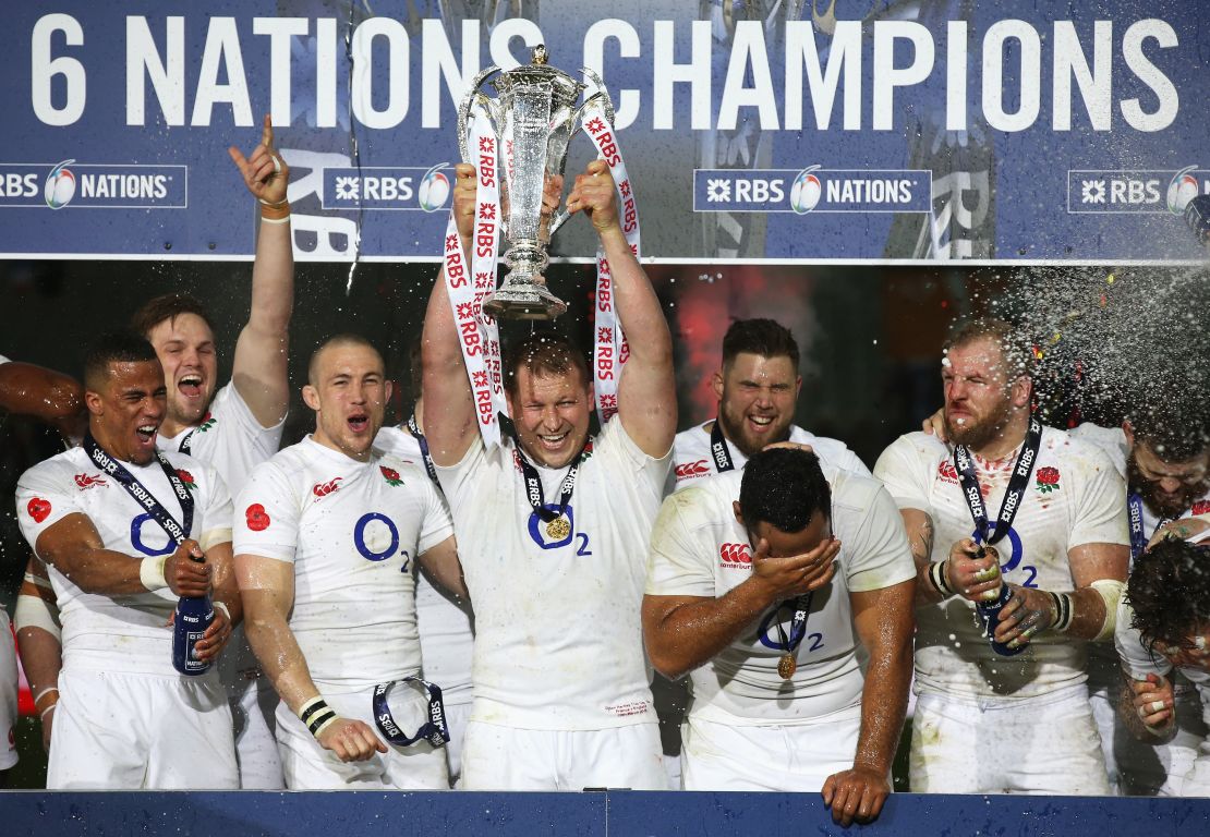 England captain Dylan Hartley lifts the Six Nations trophy at Stade de France.