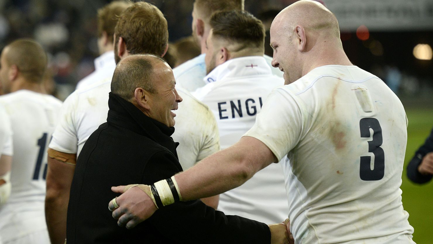 England's head coach Eddie Jones (L) celebrates with prop Dan Cole after beating France on March 19.