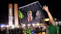 Demonstrators outside the National Congress protest against the administration of President Dilma Rousseff and in support of Judge Sergio Moro, who is spearheading the Operation Carwash anti-corruption investigation, in Brasilia on March 21, 2016. Brazilian lawmakers relaunched impeachment proceedings against Rousseff and a judge blocked her bid to bring her powerful predecessor Luiz Inácio Lula da Silva into her cabinet, intensifying the political crisis engulfing her government.  AFP PHOTO/ANDRESSA ANHOLETE / AFP / Andressa Anholete        (Photo credit should read ANDRESSA ANHOLETE/AFP/Getty Images)