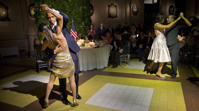 U.S. President Barack Obama, left, and first lady Michelle Obama, right, tango with dancers during a state dinner in Buenos Aires on Wednesday, March 23.