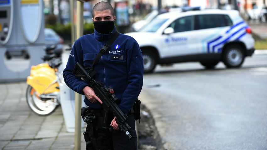 A police officer patrols near a tramway train after it was evacuated during an anti-terrorist operation in the Schaerbeek - Schaarbeel district in Brussels on March 25, 2016.
Belgian police carrying out a fresh anti-terrorist operation today arrested a suspect, who suffered a slight injury, Schaerbeek Mayor Bernard Clerfayt told AFP. Police sources said the operation was connected to a foiled terror plot in France.  / AFP / PATRIK STOLLARZ        (Photo credit should read PATRIK STOLLARZ/AFP/Getty Images)