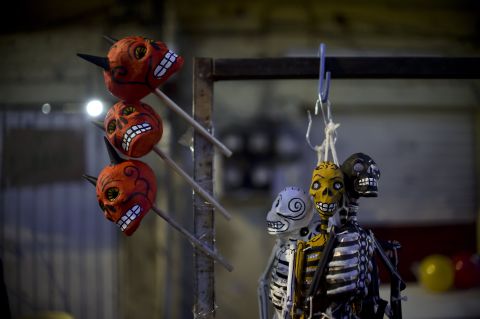 Colorful skull figures are displayed for sale during Holy Week celebrations in Mexico City.