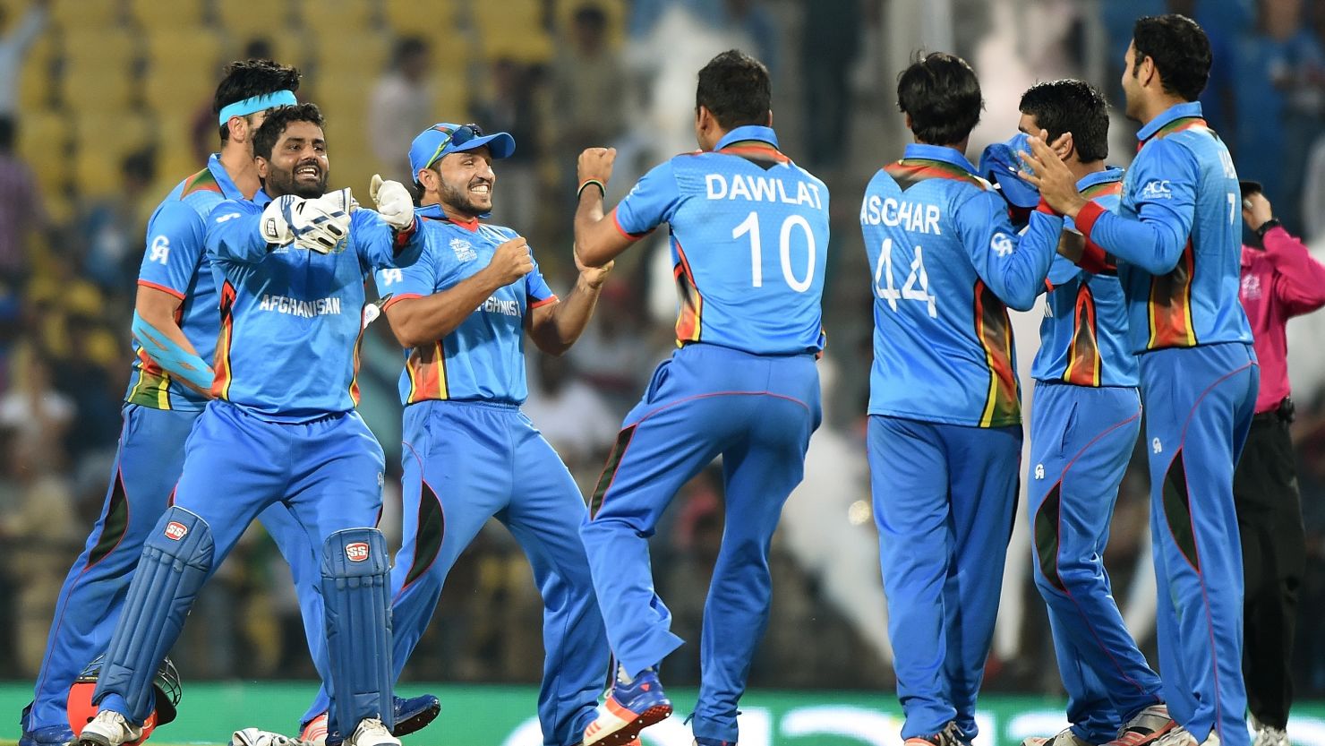 Afghanistan's players celebrate a historic victory after a six-run win over West Indies in Nagpur in the World Twenty20 tournament. 