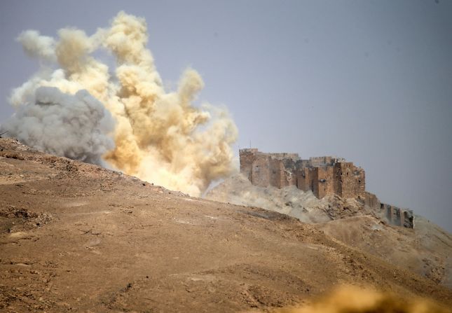A dust cloud rises near the Palmyra Castle during the military operation to retake Palmyra on March 25.