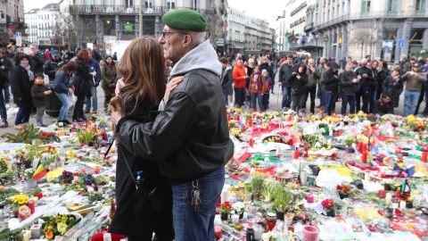 People gather on the on the Place de la Bourse in central Brussels on March 27 in a tribute to bombing victims.