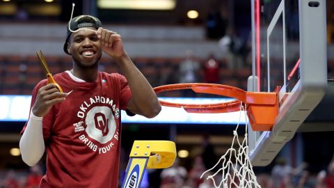 Buddy Hield smiles after cutting a piece of the net after the No. 2 Oklahoma Sooners advanced to the Final Four with an 80-68 victory against the No. 1 Oregon Ducks on Saturday in Anaheim, California.
