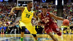 ANAHEIM, CA - MARCH 26:  Buddy Hield #24 of the Oklahoma Sooners drives on Elgin Cook #23 of the Oregon Ducks in the second half in the NCAA Men's Basketball Tournament West Regional Final at Honda Center on March 26, 2016 in Anaheim, California.  (Photo by Harry How/Getty Images)