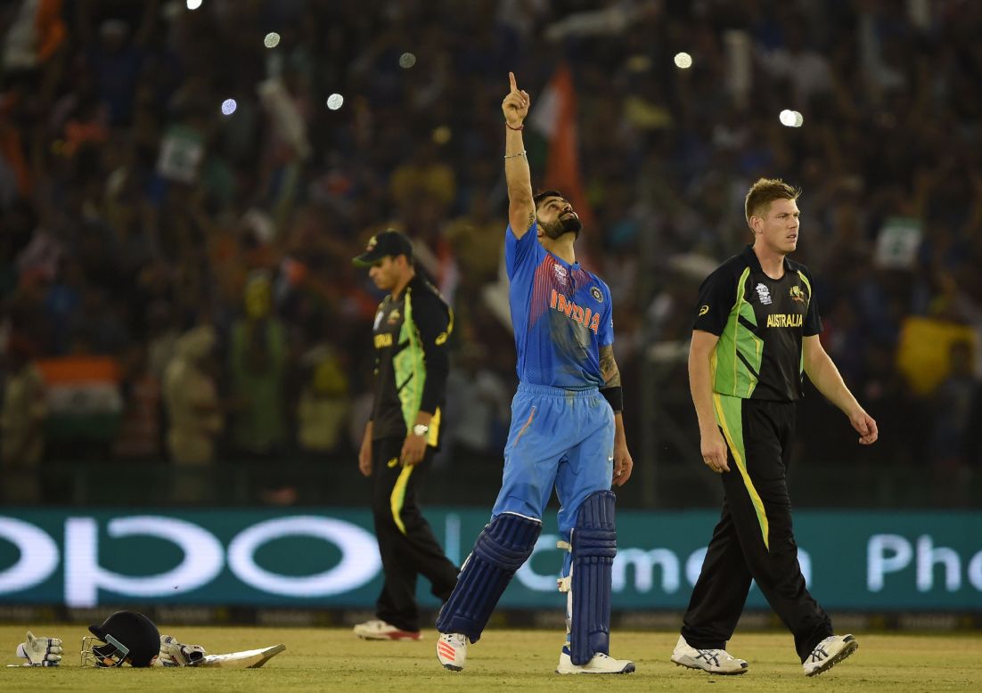 Virat Kohli points to the heavens after guiding India to its crucial group victory over Australia in the Twenty20 World Cup. 