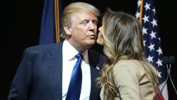 MANCHESTER, NH - FEBRUARY 08:  Republican presidential candidate Donald Trump kisses his wife, Melania Trump, during a campaign rally at Verizon Wireless Arena on February 8, 2016 in Manchester, New Hampshire. Democratic and Republican Presidential candidates are finishing up with the last full day of campaigning before voters head to the polls tomorrow.  (Photo by Joe Raedle/Getty Images)