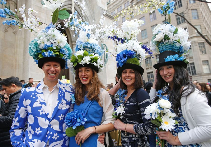 Tom Nickel, Allison and Adrian Devereux, and Jane Pastrana show off their floral-themed Easter clothes as they pose for photographers and members of the public.