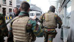 BRUSSELS, BRUXELLES-CAPITALE, REGION DE - MARCH 27: Soldiers patrol the area after a peaceful gathering was disrupted by right-wing demonstrators on March 27, 2016 in Brussels, Belgium. The demonstration in the Place de la Bourse is believed to be in reaction to last week's terrorist attacks in Brussels and was later dispersed by riot police using water cannons. (Photo by Sylvain Lefevre/Getty Images)